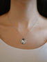 Load image into Gallery viewer, Model wearing gothic constellation locket necklace by Anzie crafted in rhodium plated sterling silver with sparkling white sapphires.