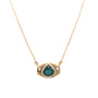 Load image into Gallery viewer, A gold necklace with a unique eye-shaped pendant featuring a teardrop-shaped dark blue tourmaline, shown against a plain white background.