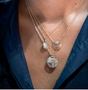 Load image into Gallery viewer, Model wearing 14k light yellow gold necklace featuring a marquise-cut diamond at the center, accented with pavé-set white diamonds for a delicate, radiant finish.