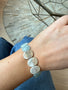 Load image into Gallery viewer, Model wearing Philippa Roberts Three Large Nuggets bracelet with softly hued amazonite stones set in sterling silver, handmade in Oakland, California.
