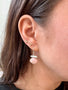 Load image into Gallery viewer, Model wearing handcrafted sterling silver earrings by Philippa Roberts set with soft pink faceted pink opal gemstones.
