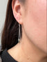 Load image into Gallery viewer, Model wearing minimalist sterling silver nugget dangle earrings with organic textured drops, 2 inch length on balled earwires, handmade in Oakland, California.
