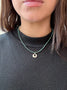 Load image into Gallery viewer, Model wearing Philippa Roberts handmade turquoise necklace with small open drop sterling silver pendant.
