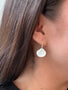 Load image into Gallery viewer, Model wearing small hammered drop earrings in silver or vermeil by Philippa Roberts, handmade textured metal drop earrings.
