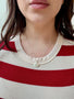 Load image into Gallery viewer, Model wearing small hammered drop necklace in silver or vermeil by Philippa Roberts, handmade textured pendant jewelry.
