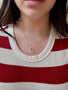 Load image into Gallery viewer, Model wearing sterling silver necklace with two small oval pendants on a delicate cable chain by Philippa Roberts.
