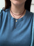 Load image into Gallery viewer, Model wearing Anne Sportun concave disc charm on wrap necklace.
