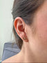 Load image into Gallery viewer, Model wearing Misa Jewelry sunrise stud earrings in solid 14K yellow gold with diamond accents at the center.
