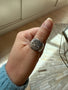 Load image into Gallery viewer, Model wearing Digby &amp; Iona Whitman sterling silver signet ring engraved with a quote from Leaves of Grass and astronomical artwork inspired by De Sphaera.
