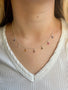 Load image into Gallery viewer, Model wearing handmade multi sapphire drop necklace in silver by Philippa Roberts.
