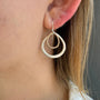 Load image into Gallery viewer, Model wearing handmade double drop textured earrings inmixed metal by Philippa Roberts.
