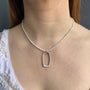 Load image into Gallery viewer, Model wearing silver open rectangle pendant necklace on freshwater pearls, 16 inch strand with extender, handmade in Oakland, California.
