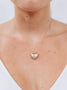 Load image into Gallery viewer, Model wearing Anzie heart-shaped locket necklace in yellow gold featuring a star motif with a diamond center, elegant keepsake pendant jewelry that makes a bold statement and holds cherished memories close.
