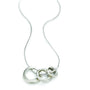 Load image into Gallery viewer, Handmade sterling silver three-ring pendant necklace by Philippa Roberts featuring delicate moving rings on an 18-inch snake chain, with 1/4–1/2 inch rings and sterling silver findings, made in Oakland, CA.
