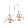 Load image into Gallery viewer, Sterling silver snow drop inspired earrings with three 14k yellow gold pin set ruby beads dangling from each, by Annette Ferdinandsen. 
