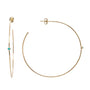 Load image into Gallery viewer, 14k yellow gold thin hoops with a single bezel set cabachon turquoise on each by Zoe Chicco.
