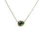 Load image into Gallery viewer, A 14k yellow gold necklace featuring a stationed prong set rosecut emerald pendant surrounded by a frame of pave white diamonds. 
