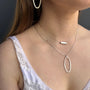 Load image into Gallery viewer, Model wearing tube bead necklace in sterling silver by Philippa Roberts. 
