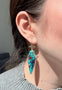 Load image into Gallery viewer, Model wearing 14k yellow gold drop earrings with carved blue-green chrysocolla stones featuring natural shattuckite inclusions.
