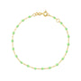 Load image into Gallery viewer, 18k yellow gold 7.5" cable chain bracelet with anis colored resin beads by Gigi Clozeau. 
