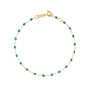 Load image into Gallery viewer, 18k yellow gold 7.5" cable chain bracelet with emerald colored resin beads by Gigi Clozeau. 
