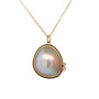 Load image into Gallery viewer, an Ananda Khalsa mabe pearl is wrapped in 22k gold and accented with two sparkling white diamonds. The setting is backed with sterling silver.
