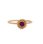 Load image into Gallery viewer, An Ananda Khalsa ring with a round ruby set in a 22 karat yellow gold bezel with a halo of white diamond bezel set stones upon an 18 karat yellow gold band.

