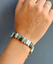 Load image into Gallery viewer, Handcrafted sterling silver bracelet by Philippa Roberts set with labradorite and aquamarine gemstones, 7.5 to 8 inches long, made in Oakland, CA.
