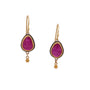Load image into Gallery viewer, A pair of gold drop earrings featuring teardrop-shaped ruby gemstones in a gold bezel setting with a small dangling gold bead, shown against a plain white background.
