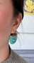Load image into Gallery viewer, Model wearing 18k yellow gold drop earrings with one-of-a-kind turquoise stones
