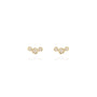 Load image into Gallery viewer, A pair of small graduated bezel-set white diamond stud earrings in 14k yellow gold.
